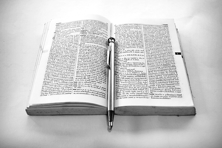 Bible and a ballpen in black and white